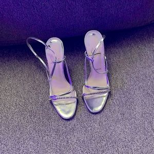 A Pair of Christian Louboutin Red botton shoes